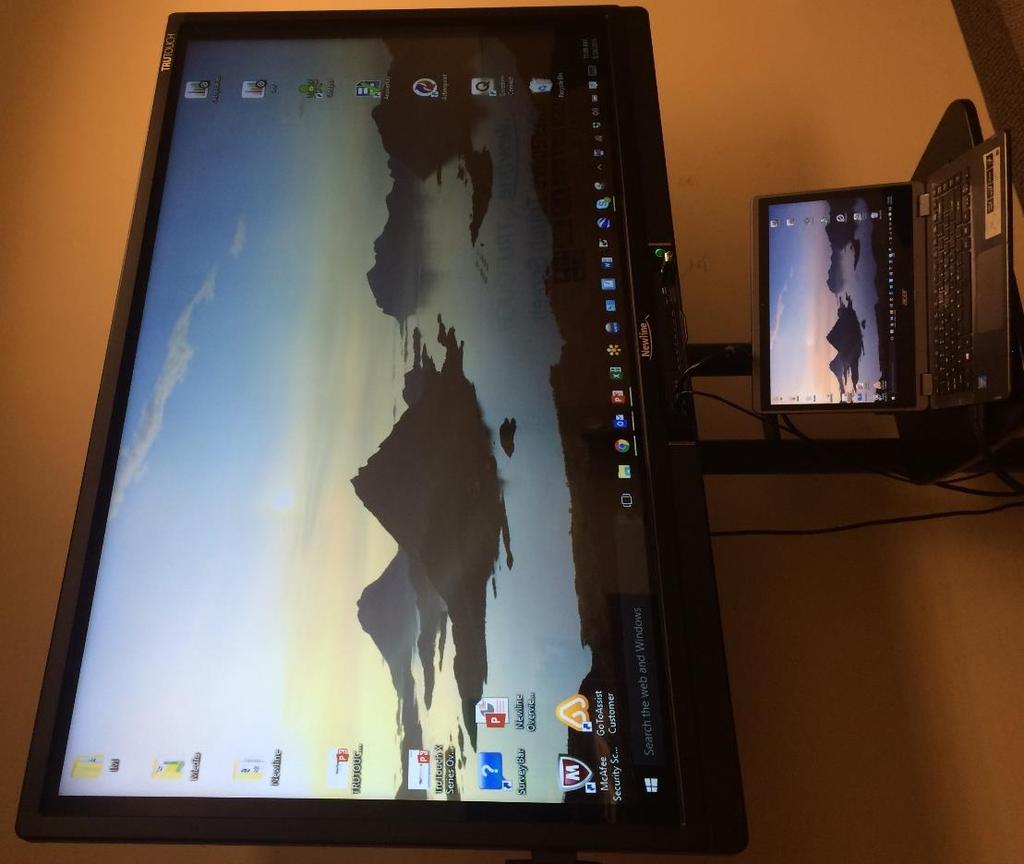 When a computer is projecting, the TRUTOUCH simply becomes a giant tablet.