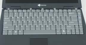 11 Raise the back edge of the keyboard,