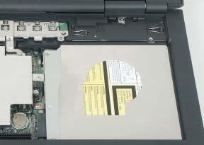 Replacing the optical drive To replace the optical drive: 1 Remove the screw that secures the drive to