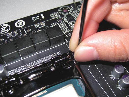 Step 3: Once the CPU is properly inserted, carefully replace the load plate.