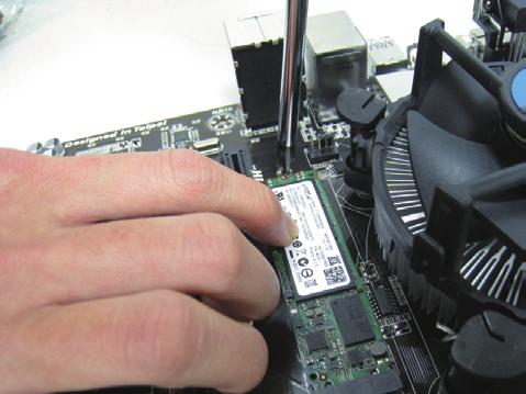 2 SSD into the connector at an oblique angle. Step 3: Press the M.2 SSD down and then secure it with the screw.