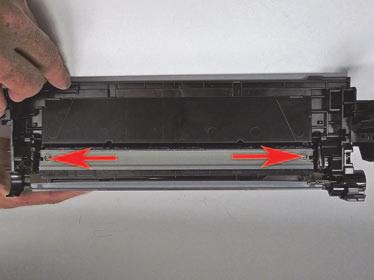 8. Remove the two screws from the wiper blade.