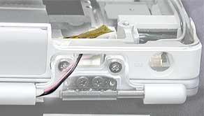 Procedure 1. With the computer on a soft cloth, remove the two identical screws from the clutch cover that is next to the power adapter port, as shown. 2. Use a black stick to remove the clutch cover.