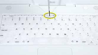Procedure 1. Raise the display so you can access the keyboard. 2. Make sure the keyboard locking screw, located in the small plastic tab next to the Num Lock key, is not in the locked position.