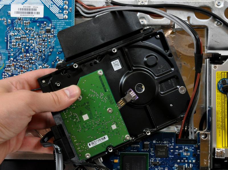 When reinstalling your hard drive, be careful not to push the two rubber grommets