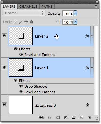 Step 16: Merge The Two Shapes Onto A New Layer With Layer 1 selected, hold down your Ctrl (Win) / Command (Mac) key and click on Layer 2 in the Layers panel.