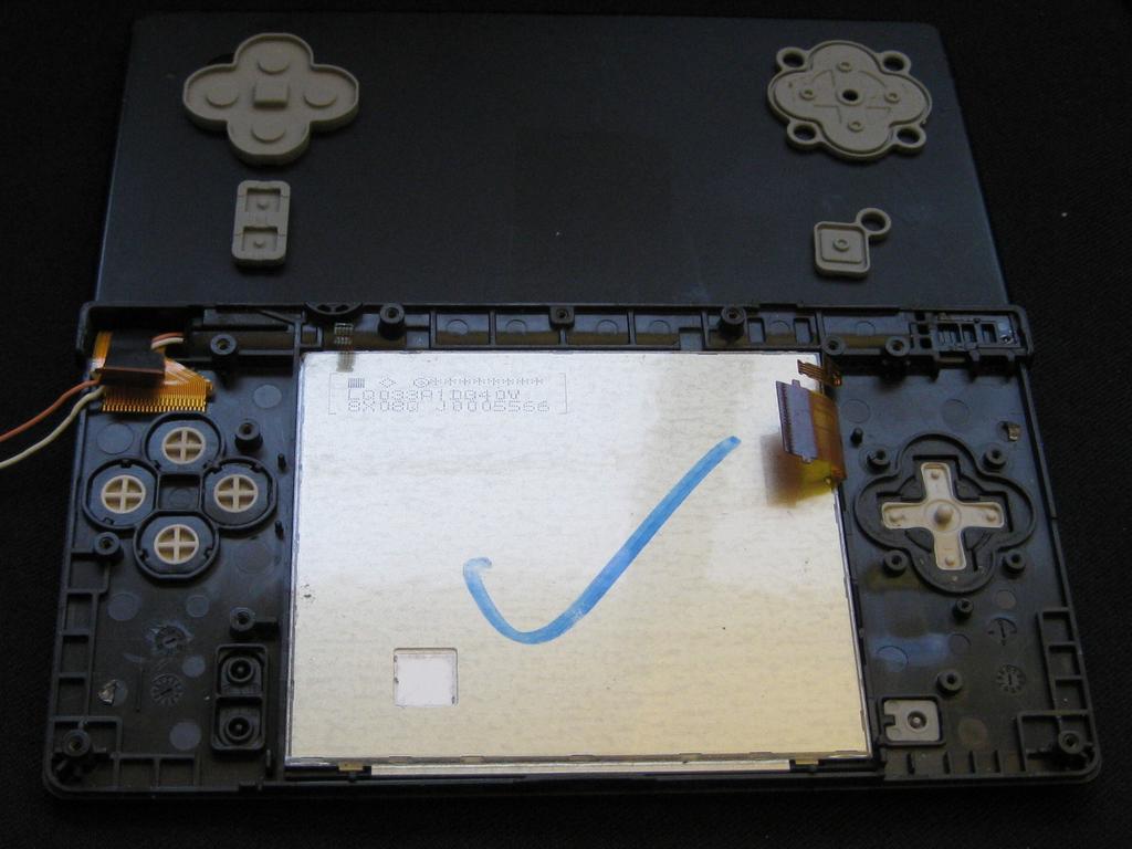 Keep the main board fairly close to the case, making sure not to damage the last ribbon cable holding it in place.