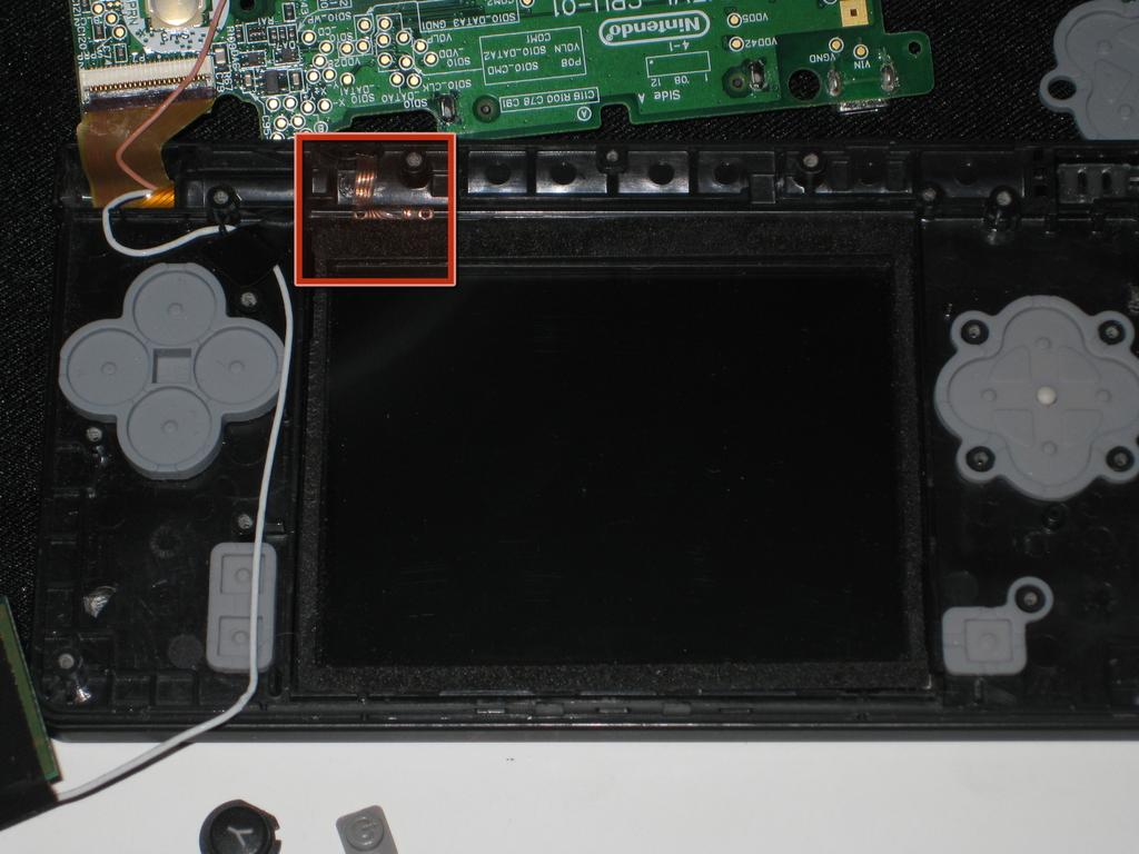 Nintendo DSi Touch Screen / Bottom LCD Replacement Step 16 It is important that the touch screen and LCD sit perfectly flat in the frame, or else you will not be able to close up the device.