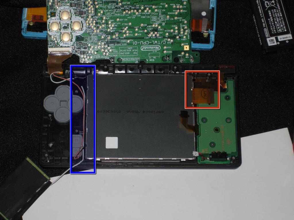 Place the LCD on top of the touch screen, with the two ribbon cables pointing towards the battery board (as shown in the picture).