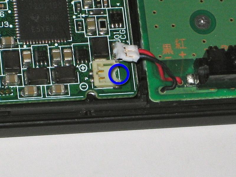 Put the corner of your screwdriver in there, and twist it gently to push the white part up (away from the main board).