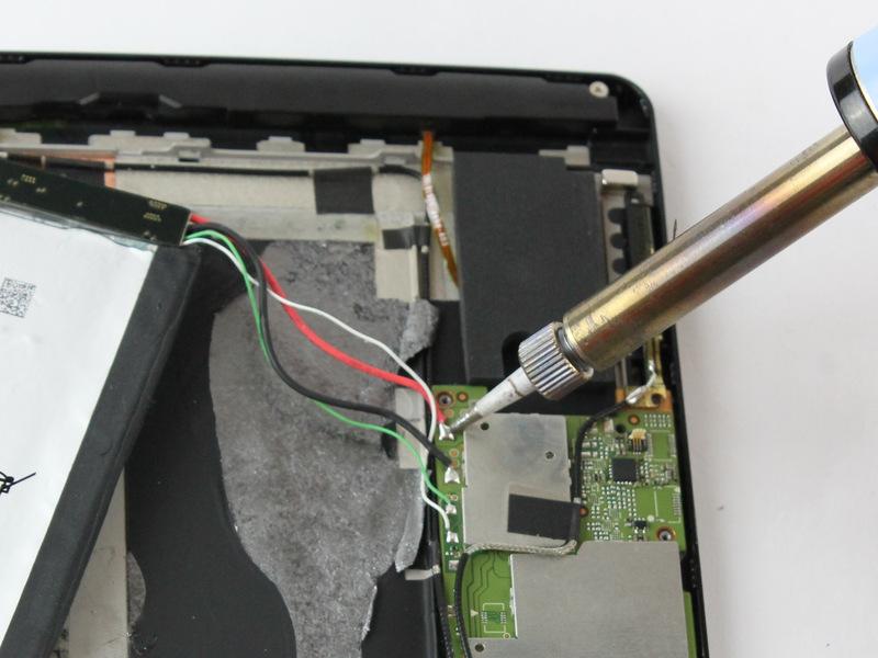 Be careful not to damage these wires while removing the battery.