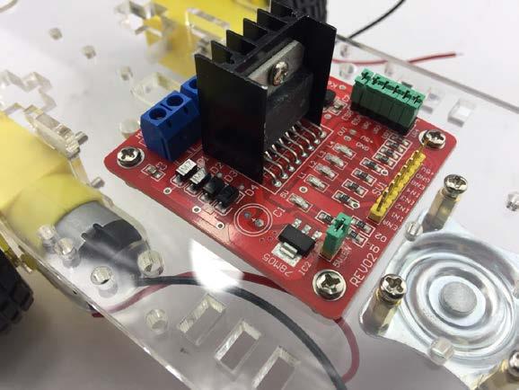 Secure the L289N Motor Driver Board as shown on the left Pull the