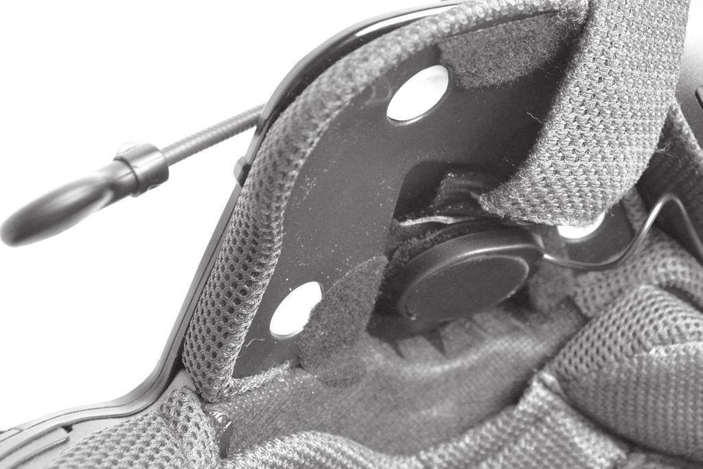 speaker-microphone clamp unit on the external surface of the helmet.