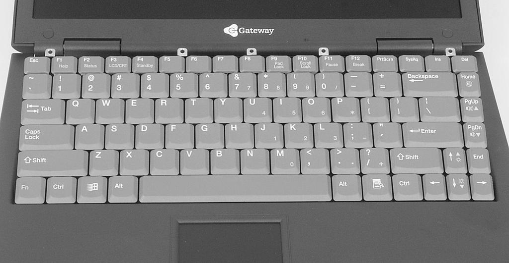 11 Lift the back edge of the keyboard, then