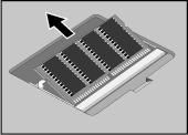 Release the two latches at the sides of the RAM expansion module by pushing them gently outward (away from the sides of