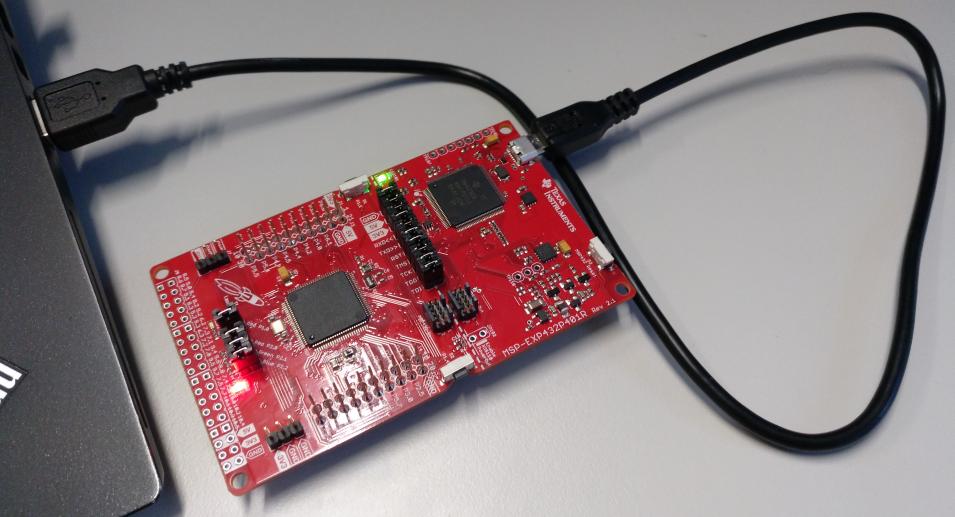 Figure 1: A basic overview of the MSP-EXP432P401R LaunchPad Development Board (left) and connected to a laptop via USB (right). We use Code Composer Studio (CCS) as development environment.