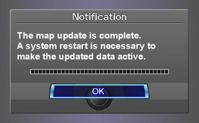 The update status screen is displayed while the navigation system downloads the update (about 40 minutes).