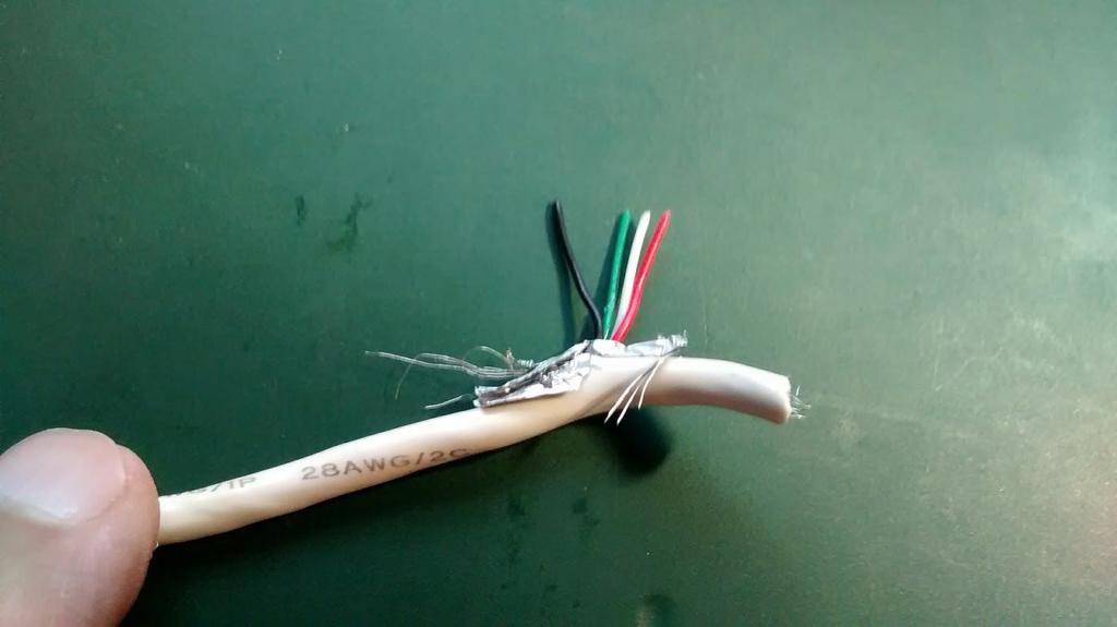 Cut away any shielding wires, and the white and green wires.