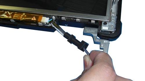 Follow these steps to remove the grommets from the left and right side of the display assembly.