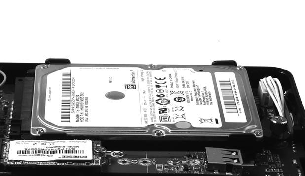 Secure the installed drive with a thumb screw. *1 TB 2.