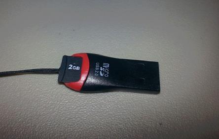 As Illustrated below, the SD card will fit into the slot that is located on top of the USB Adaptor. 2.