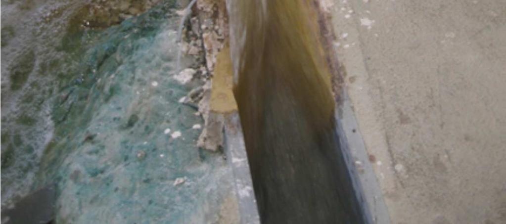 wall of the spillway, downstream of the septum (see