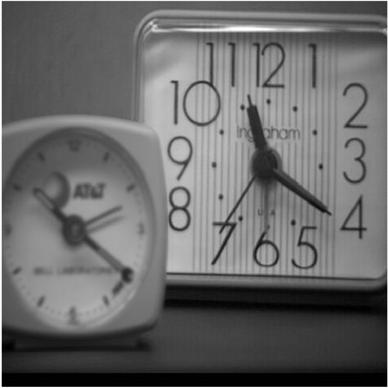 [2]. (a) (b) (c) Fig. 1.2. CCD visual images with the (a) right and (b) left clocks out of focus, respectively; (c) the resulting fused image from (a) and (b) with the two clocks in focus.