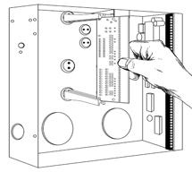 The end with the half-moon protrusion fits into the larger hole. The smaller hole is for the screw. Diagram : Place the first black plastic PCB guide in the top insertion point, grooved edge downward.