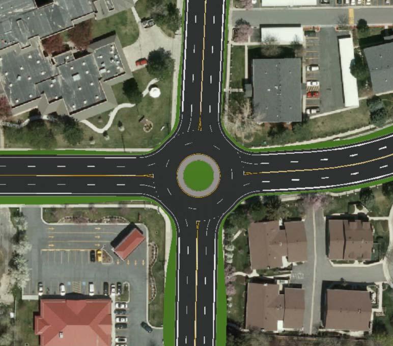 Create a Roundabout 1. Set the Camera Orientation to the Top view. 2. Zoom to the intersection of the two four lane roads east of the interchange. 3. Select Roundabout from the Road Placement Tools.