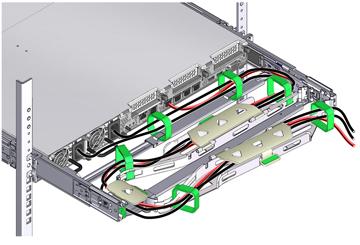Installing a ZS3-2 Cable Management Arm through the front-most cable trough, then through the small cable trough, then through the rear-most cable trough. 17.