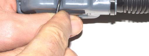 Use a small side cutter to make a slit in the cable conduit so that the five wires you removed can exit