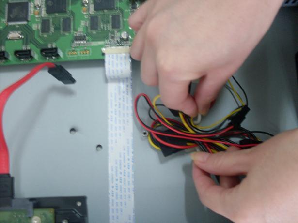 Remove the top cover from the DVR. Align the HDD with the holes provided on the HDD bracket.