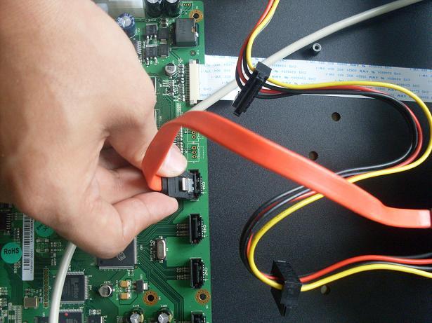 Attach the SATA cable to the HDD and to the system board. Attach the power cable to the HDD.
