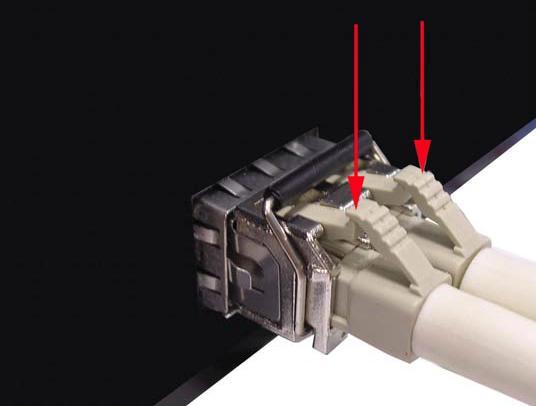 follow the steps below: First, press the upper side of the LC connector down and