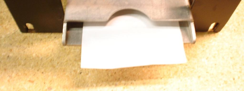 Move the Paper Feed Lever from the DOWN to the UP position (refer to Figure P2), and then pull out the remaining paper from the rear of the printer and discard the roll. 2.