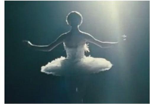 A girl is performing as a ballerina.