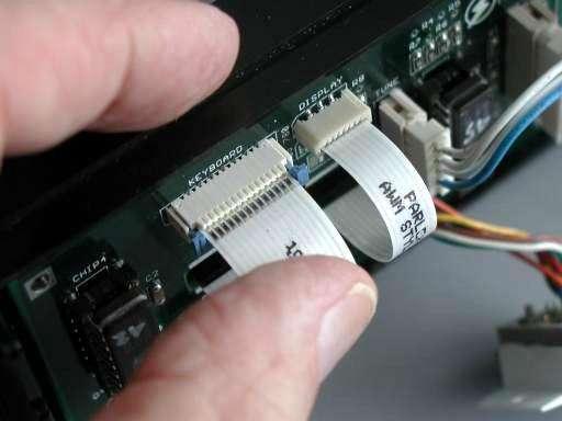 Plug the flex cables into the black connectors in
