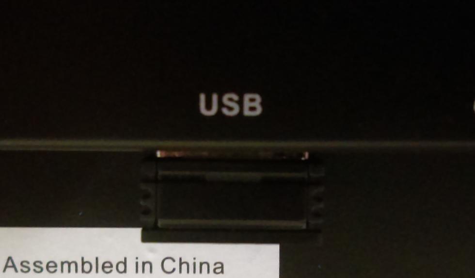 You can find it located next to the battery compartment, shown in the picture below: Insert the receiver in any of the device s USB