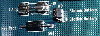 FIGURE 5. BATTERY POLARITY SELECT FOR OPTOISOLATORS ALARM INPUTS: You will require a 50-pin male ribbon connector (Amp CHAMP type) for the 32 inputs.