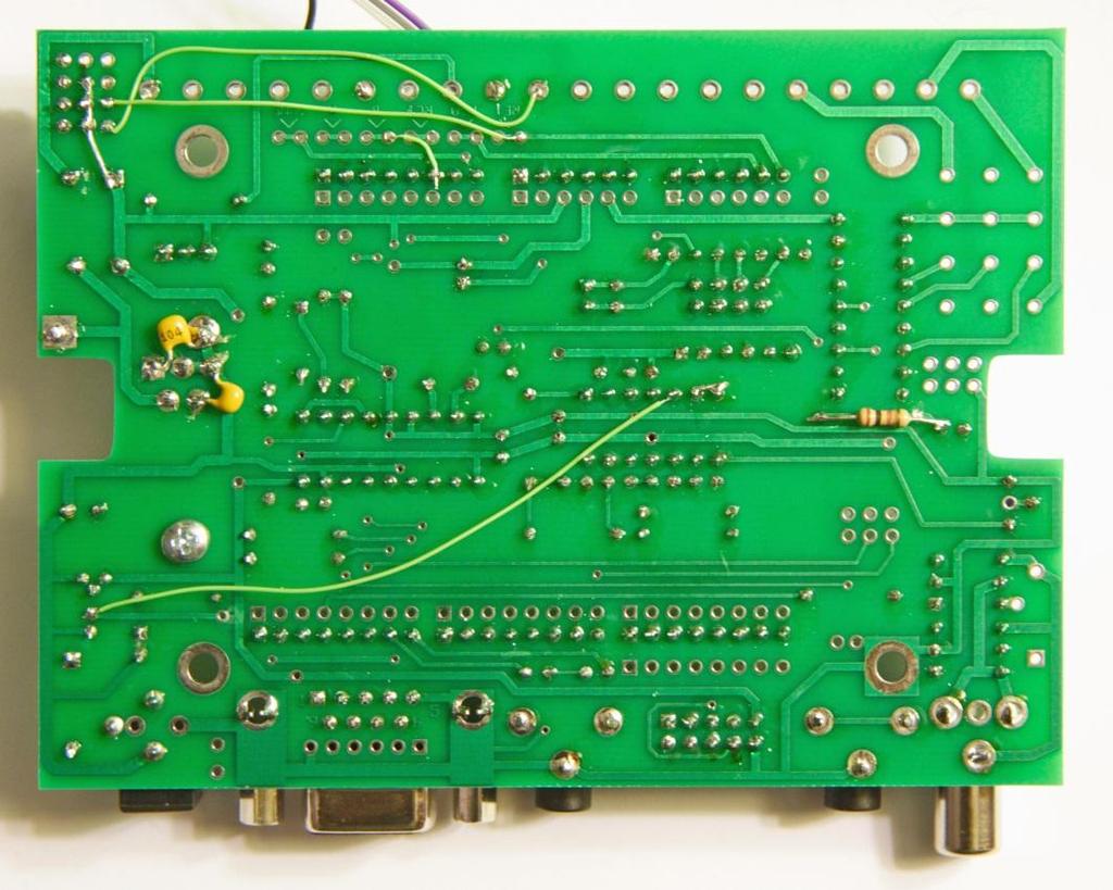 The photo below shows the bottom of the project board, with all of the modifications added. Note that the project board screw terminals were not installed.