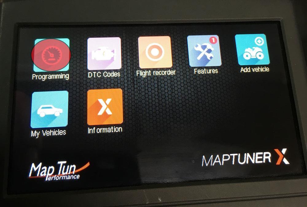 6. Press the programming button on the Maptuner display. 7.