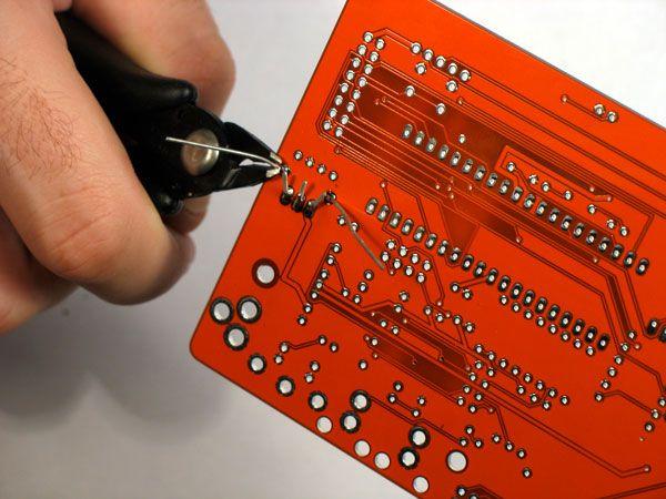 Using the cutters, cut the pins excess wire.