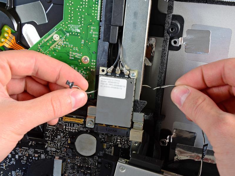 Carefully pull the optical drive off its mounting pins on the right side of the outer case to gain clearance for