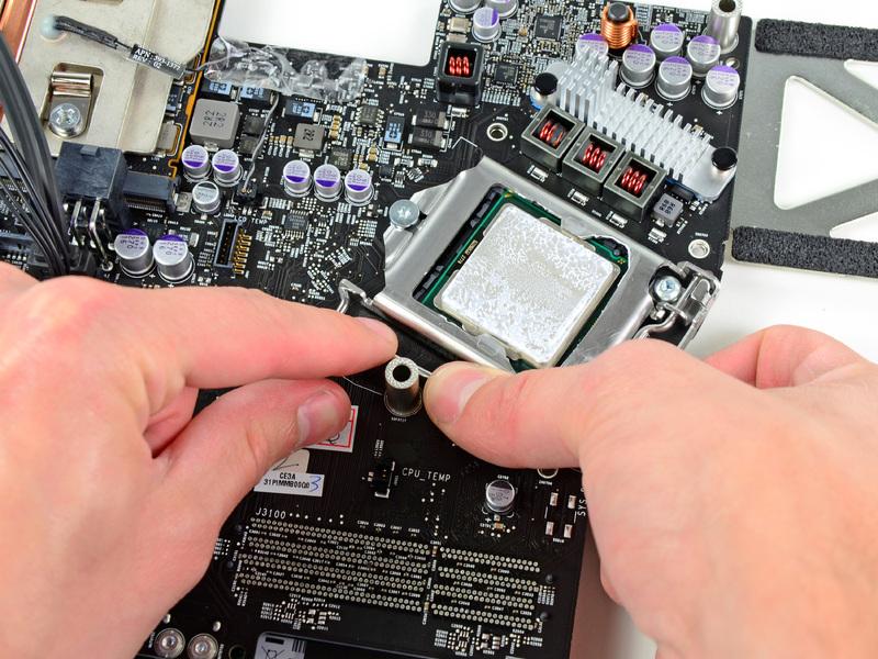 any surfacemount components on the logic board. Make sure to apply a new layer of thermal paste before reattaching the heat sink.