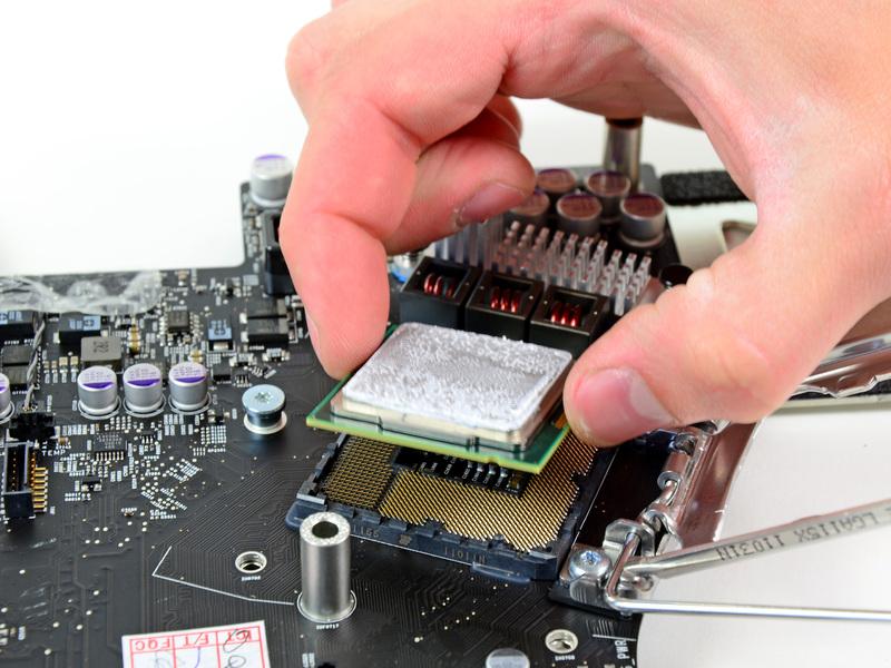 Step 50 Carefully lift the CPU straight up off its socket. Be sure your new CPU is properly aligned and seated before clamping it back down.