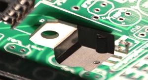 This is most easily done by first soldering in the chip sockets, then bending and inserting the voltage regulator and flipping over the circuit board, whereafter the voltage regulator is positioned