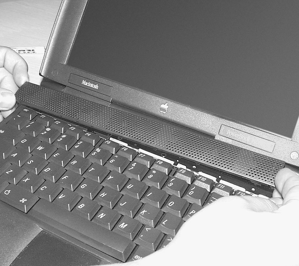 Reassemble Computer 1. Reinstall the keyboard (Figure 10). Gently lift it up and rotate it back into place, lowering the top edge of the keyboard into the upper part of the case. keyboard 2.