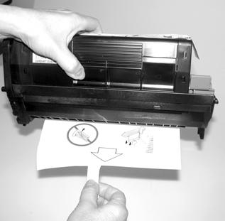 Carefully lift the black toner/drum cartridge out of