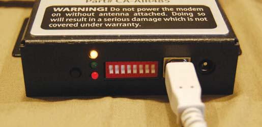 The two lower LED s indicate transmit and receive when data is flowing.