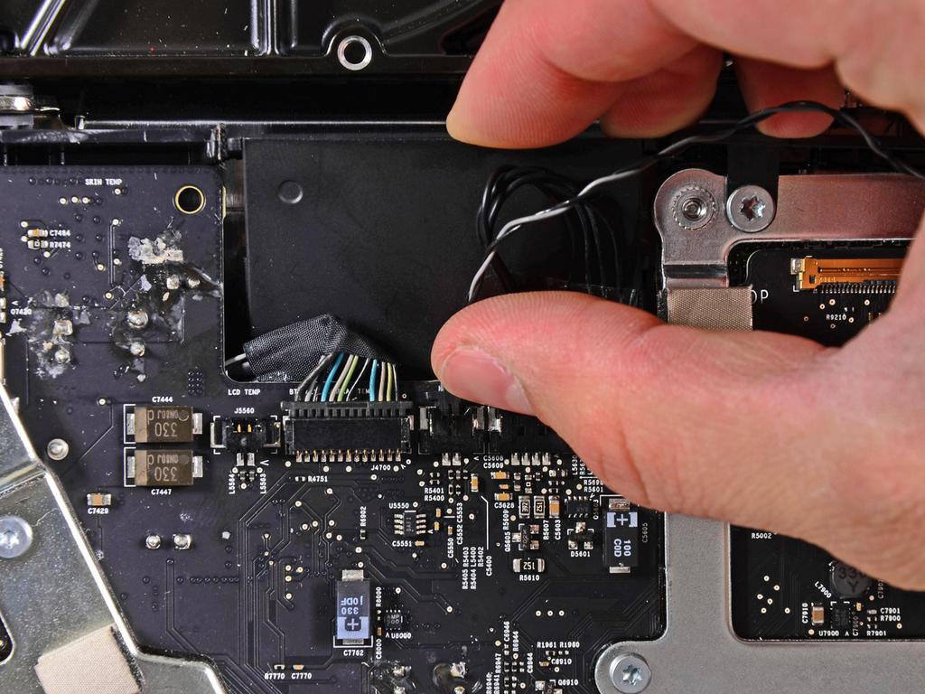 Step 28 Pull the hard drive thermal sensor cable out of its socket and toward the top edge of